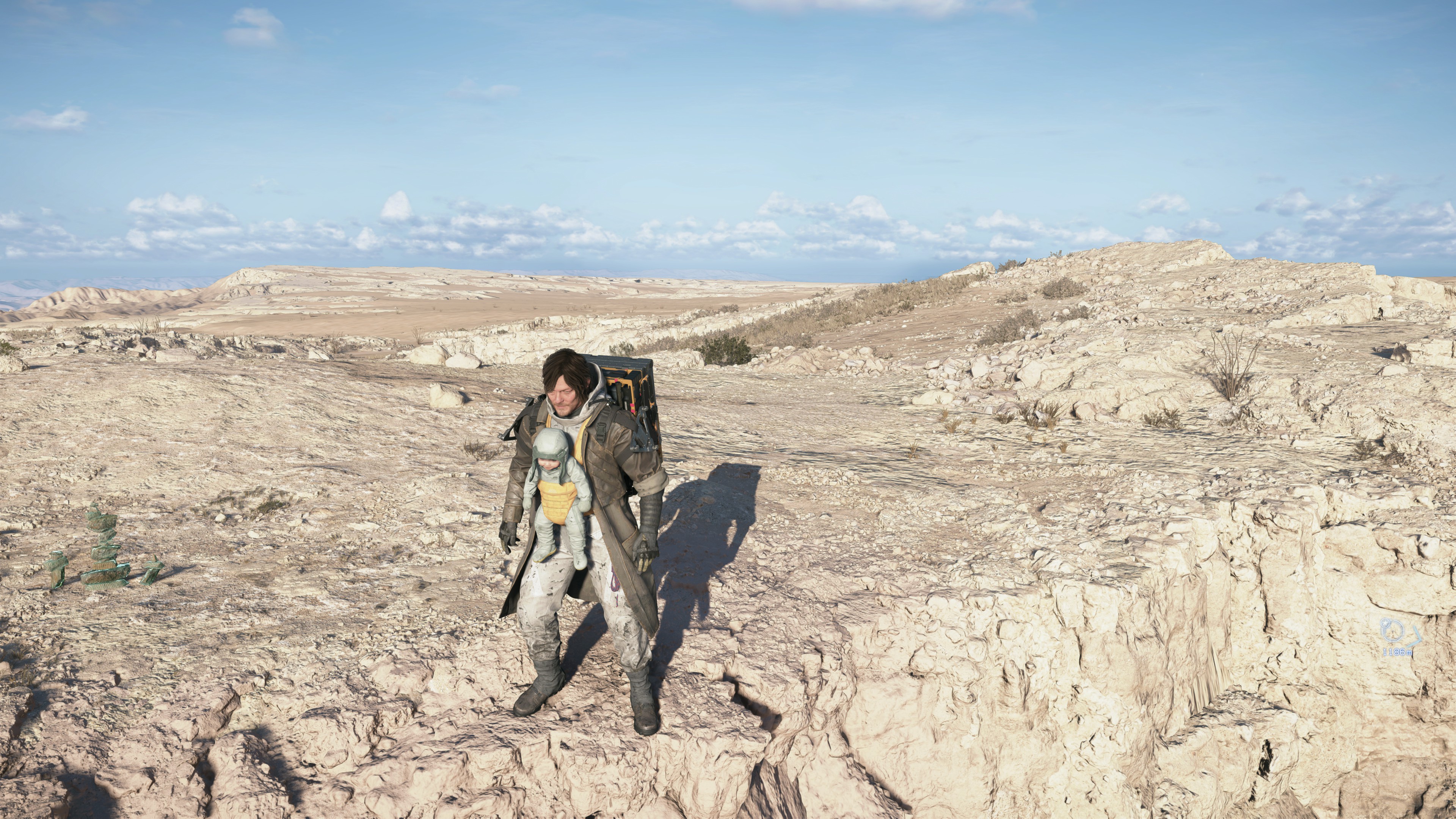 Livro de Death Stranding ao lado de controle de videogame